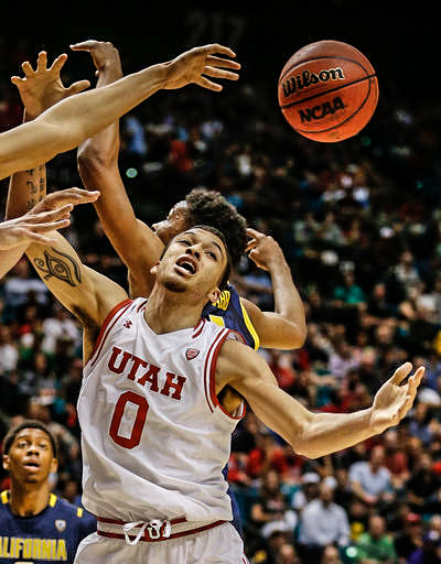 Utah forward Brekkott Chapman looks for a rebound during the first half of the team's NCAA college basketball game against California in the semifinals of the Pac-12 men's tournament Friday, March 11, 2016, in Las Vegas. (AP Photo/John Locher)